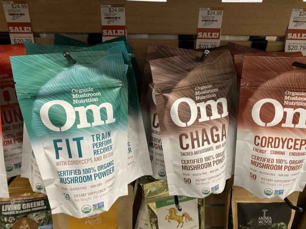 Om Mushroom Reviews vs troop mushroom reviews of packaging on rack