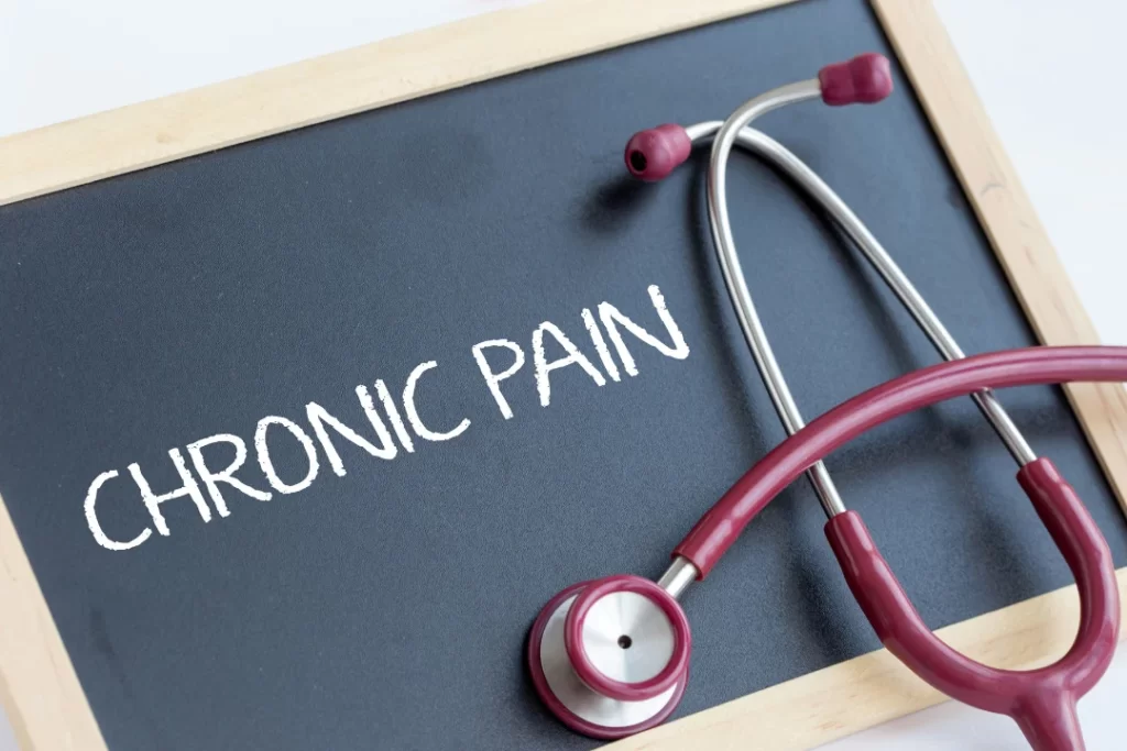 Chronic Pain was written on a slate with a stethoscope.