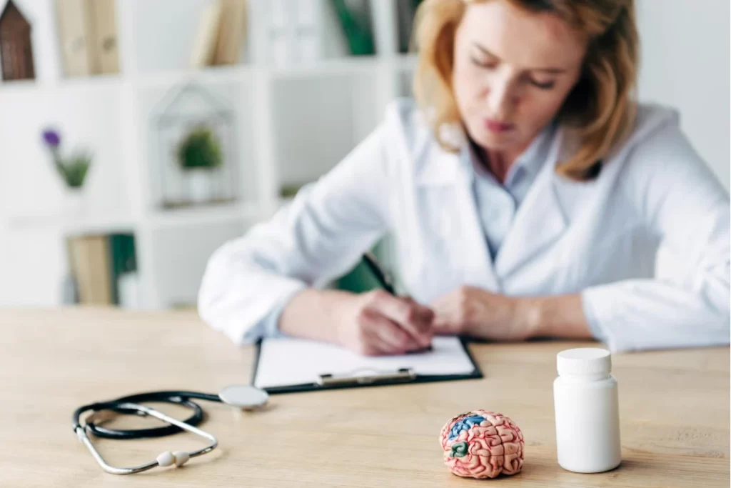 Lady doctor writing a prescription for enhancing brain capabilities.