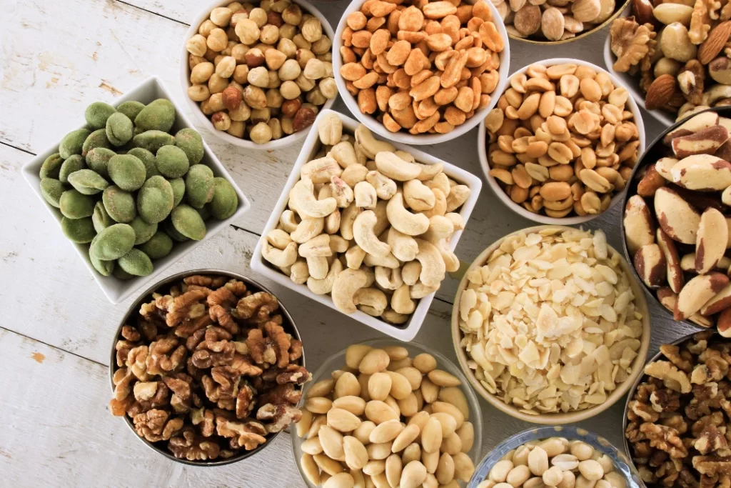 Nuts and snacks in small bowls.