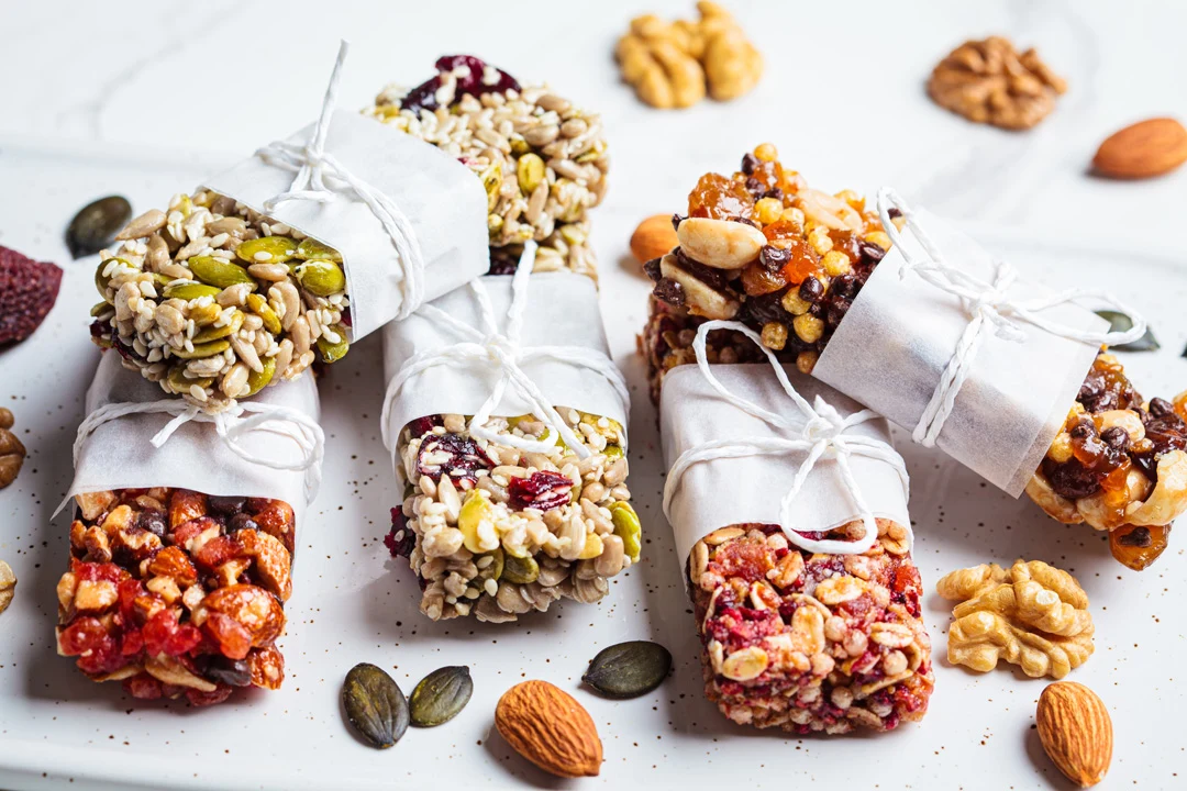 Energy granola bars with different seeds nuts and dry fruits.