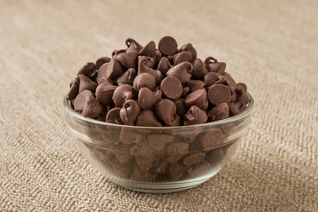 A bowl full of chocolate chips.