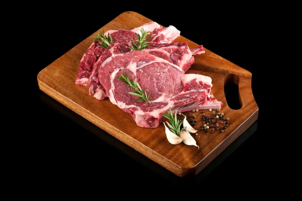 Red meat placed on a wooden tray.  
