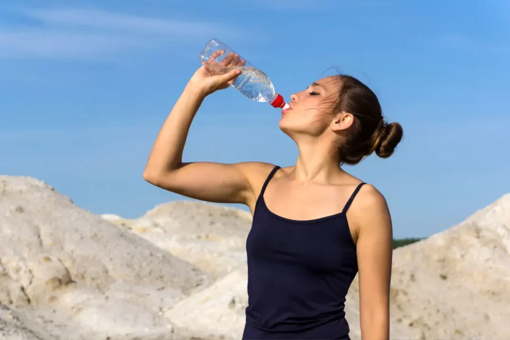 A girl drinking water.