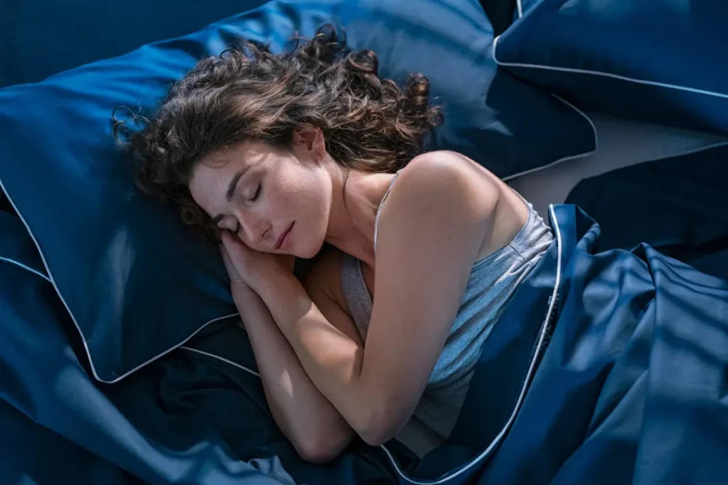 Woman sleeping deeply after taking melatonin
