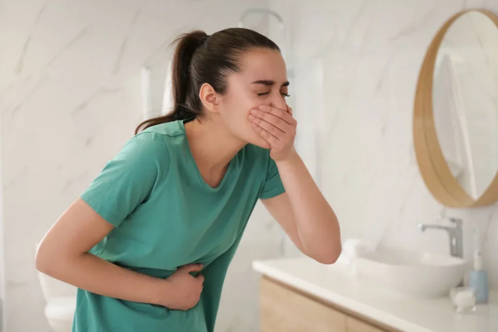 A girl having vomiting. 