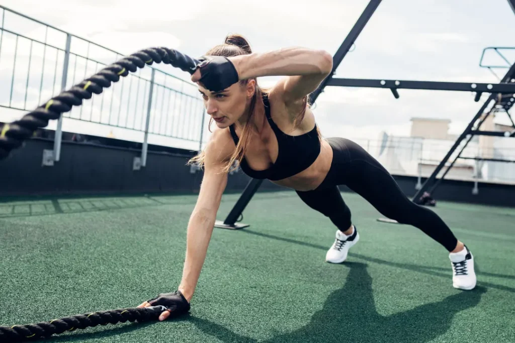 Girl exercising with hunter ropes