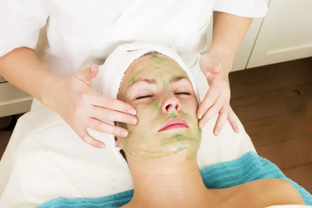A lady applied aloe-vera mask on her face. 