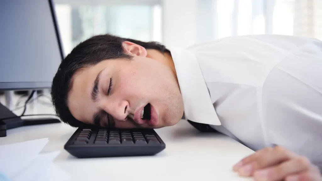 Man sleeping on the keyboard. 