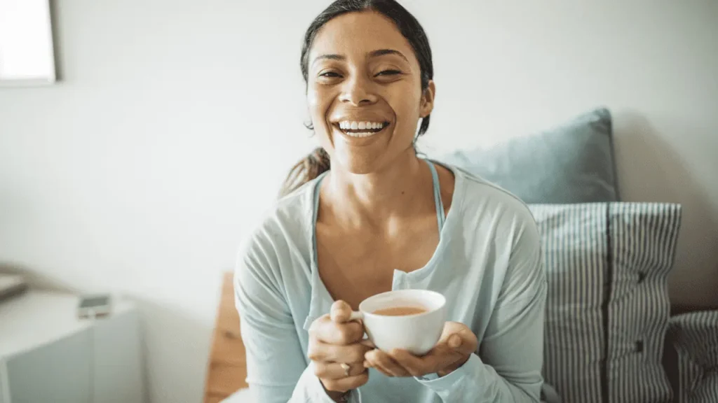 Woman having cup of tea. 