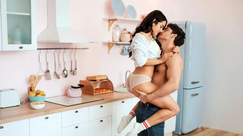 Couple Kissing in kitchen 
